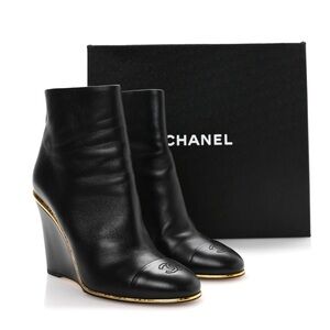 CHANEL Black Leather Wedge Boots with Gold Accent